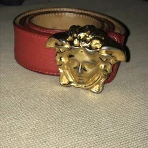 Versace belt  - Onesize  Worn quite some time and have some signs of it. Sells for 400 dollars online at cheapest when it is used. No receipts or box as it was a gift from a long time ago.