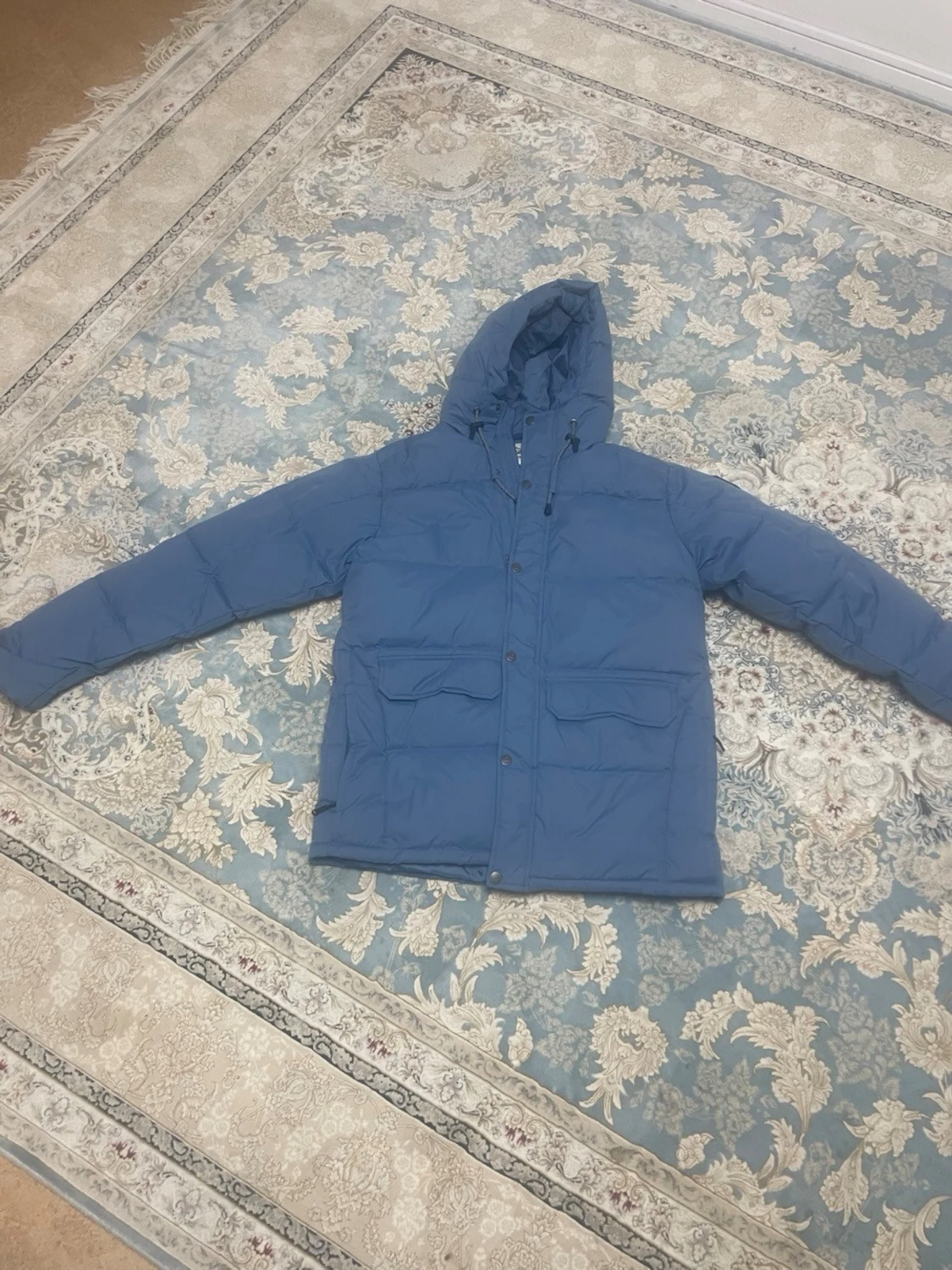 Blå dunjacka från Tuxer med huva