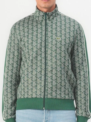 Grön mönstrad ziptröja från Lacoste XL - Säljer en grön ziptröja från Lacoste i storlek XL. Tröjan har ett geometriskt mönster, vita paneler längs ärmarna och ribbade muddar. Klassisk ståkrage och dragkedja hela vägen. Ikoniska krokodilloggan på bröstet. Perfekt för en sportig och stilren look.                                                                     Säljer åt min man, inköpt på Zalando originalpris: 2 295 kr. I nyskick och säljes pga av ingen användning. Har även det matchande byxorna till i storlek xl. Kom med rimligt bud💚