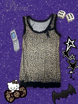 Leopard print top - Cute Y2K leopard print top with black lace and bow! I don’t know the brand since the tag was missing when i bought it, great condition!