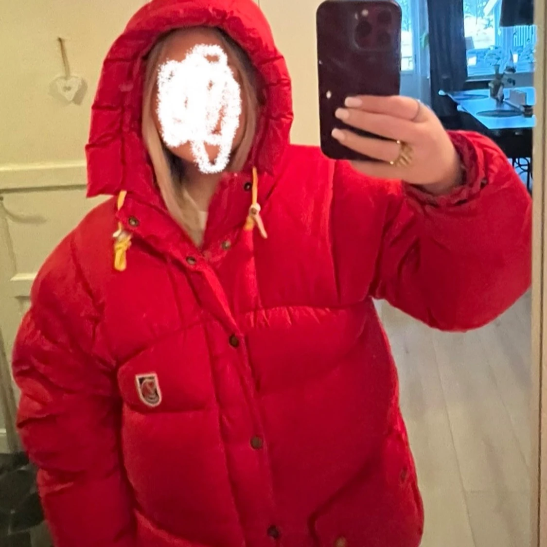 Röd dunjacka från Fjällräven