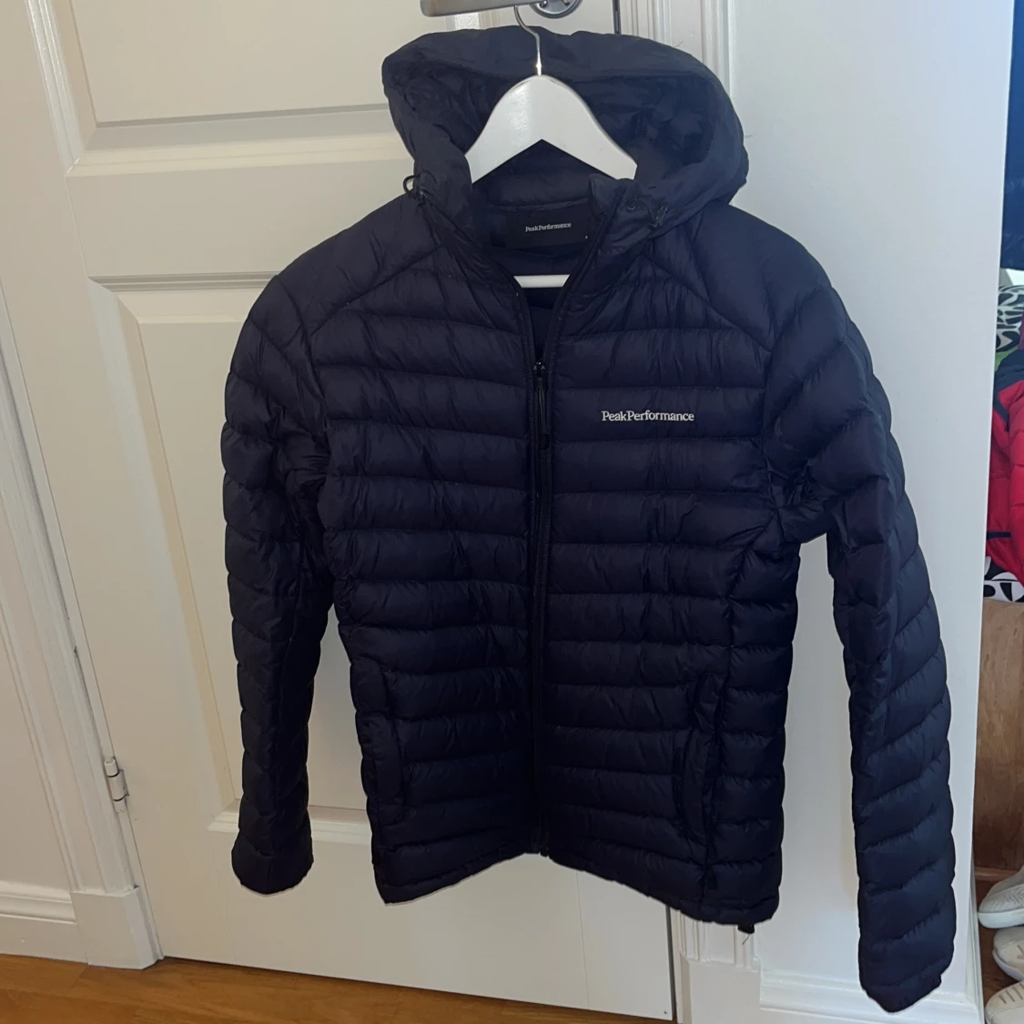 Mörkblå dunjacka Peak Performance S