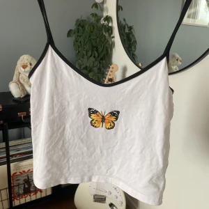Topp - Topp med fjäril på🪩