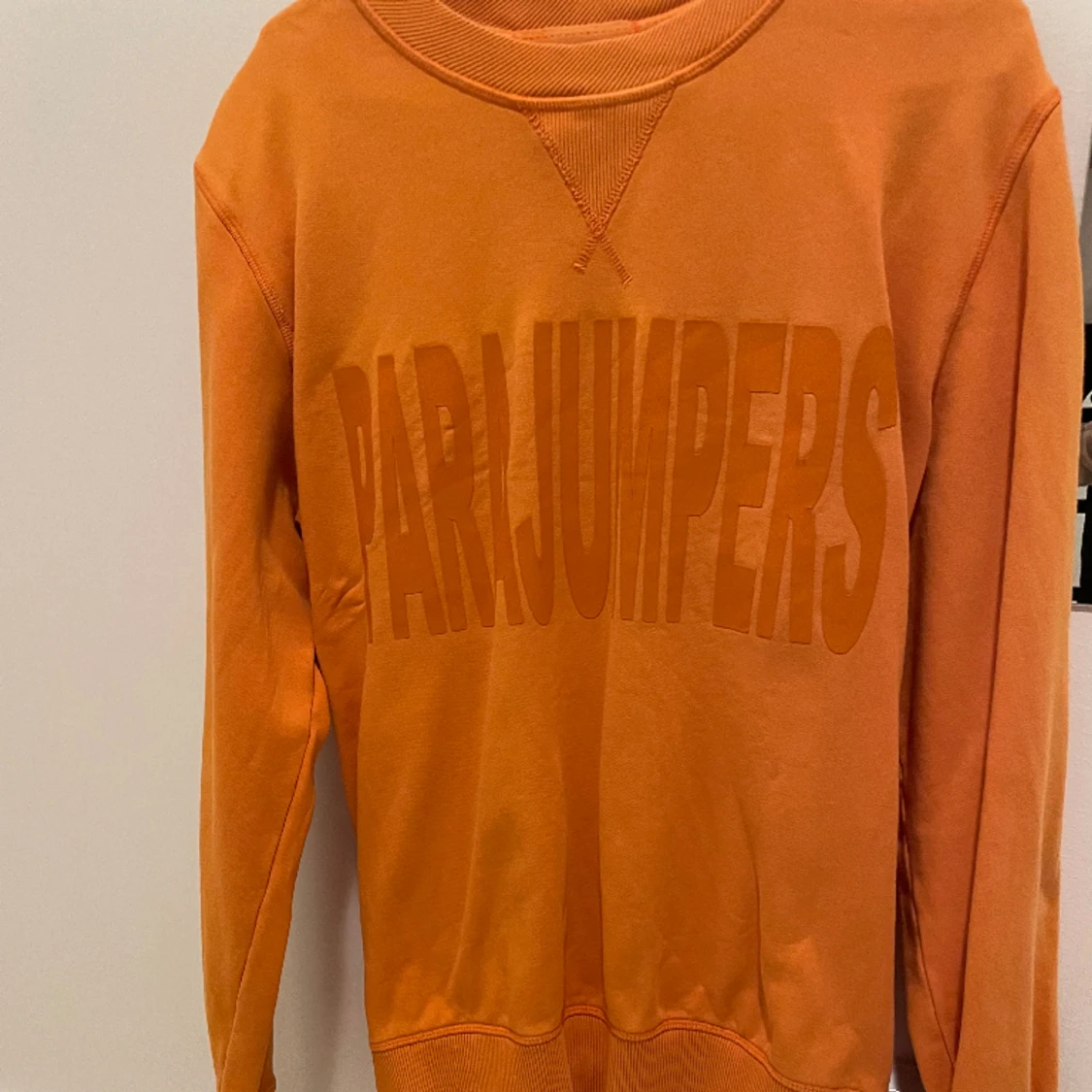 Parajumper orange. Storlek L