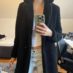 Svart kappa - Storlek xs, använd fåtal gånger.