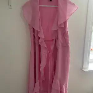 Rosa omlottklänningen 
