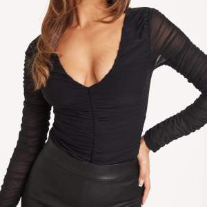 Svart bodysuit i storlek XX-Small