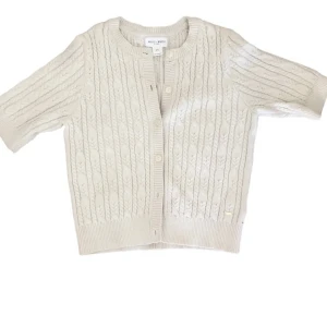 Kortärmad kofta/tröja - Jättesöt cable knit kofta från Holly&White / Lindex! Använd ett par gånger, inga defekter förutom en fläck som troligen går bort i tvätten. Men den är inte så synlig.