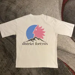 old district 46 t shirt with logo on the back and text on front 