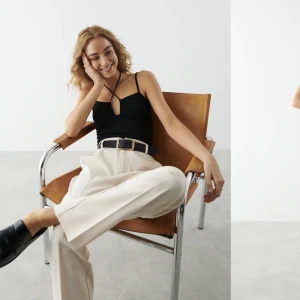 Svart body - Svart body med snörning från Gina Tricot. Aldrig använd. Storlek S.