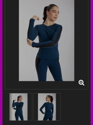 Intermezzo tränings tröja - Snygg mörkblå långärmad träningströja med svarta mesh  detaljer längs ärmarna. Tröjan har en kroppsnära passform och är tillverkad i ett stretchigt, mjukt material som passar perfekt till konståkning 