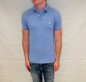 Polo Ralph Lauren Prima Stretch Mesh Polo - Ljusblå pre-owned pikétröja i bomull, modell Prima Stretch Mesh.