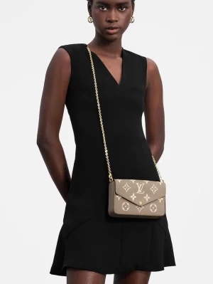 Louis Vuitton beige axelväska - Snygg beige axelväska från Louis Vuitton med ikoniskt monogrammönster i vitt. Väskan har guldfärgad kedjerem och kuvertformad lockstängning. Tillverkad i tåligt läder och perfekt för dig som vill ha en trendig och lyxig accessoar.