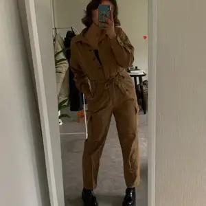 Light brown jumpsuit from H&M. Very comfortable. Fits both small and medium. Used but in good condition.