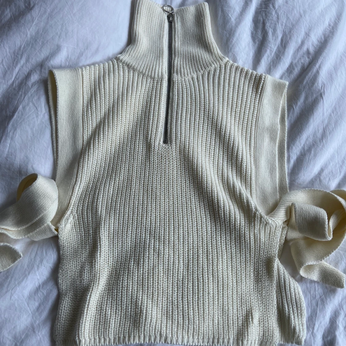 Väst med öppen sidan