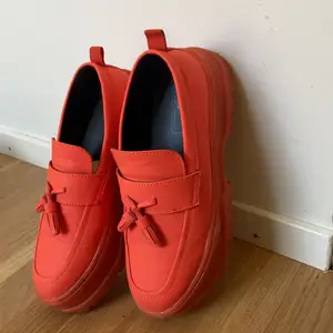 Bright orange loafers perfect for the summer