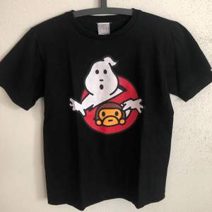 Women’s Vintage Bape / Baby Milo x Ghostbusters T-Shirt  Size small, women’s fit.  Great condition, no flaws or damage.  DM if you need exact size measurements.   Buyer pays for all shipping costs. All items sent with tracking number.   No swaps, no trades, no offers. 