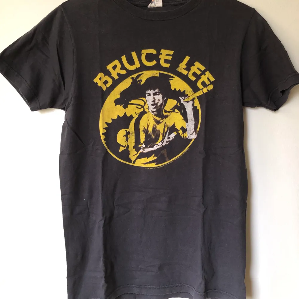 Retro Bruce Lee Game Of Death T-Shirt Size small, fits like a regular men’s size small.  Excellent condition, no flaws or damage.  DM if you need exact size measurements.   Buyer pays for all shipping costs. All items sent with tracking number.   No swaps, no trades, no offers. . T-shirts.