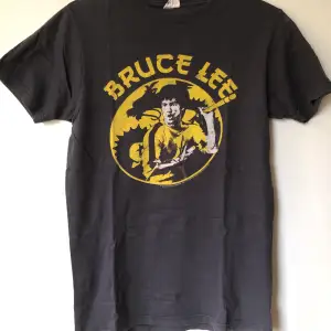Retro Bruce Lee Game Of Death T-Shirt Size small, fits like a regular men’s size small.  Excellent condition, no flaws or damage.  DM if you need exact size measurements.   Buyer pays for all shipping costs. All items sent with tracking number.   No swaps, no trades, no offers. 