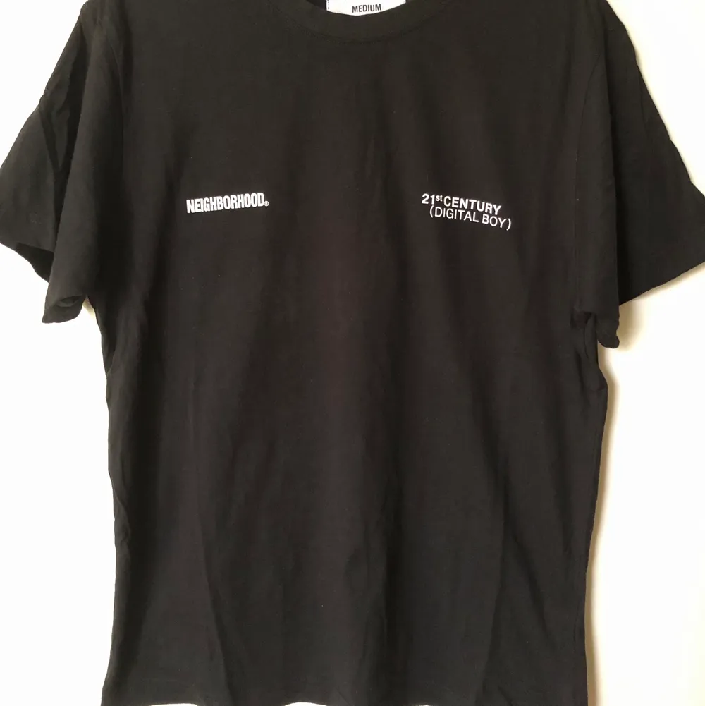 Neighborhood / NBHD Back Fist Logo T-Shirt  Size tag medium, but fits like a men’s small tee.  Great condition, no flaws or damage.  DM if you need exact size measurements.   Buyer pays for all shipping costs. All items sent with tracking number.   No swaps, no trades, no offers. . T-shirts.