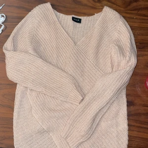 Stickad tröja  - En rosa om-lott tröja från vila, stl xl men passar även s och m