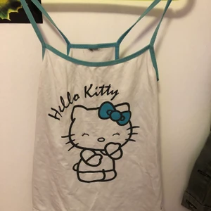 Hello kitty - Hello kitty linne som jag haft sen ja va liten i barn storlek,endå i bra skick 
