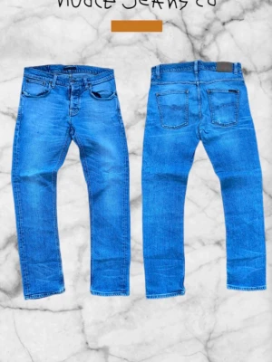 Nudie Jeans - Grim Tim - W33 L32 - Ett par riktigt snygga Nudie jeans som är perfekta nu till våren. De är helt nya och är i modellen Grim Tim. Priset är diskuterbart!