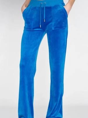 Blå Juicy Couture byxor - Säljer ett par blå mjukisbyxor från Juicy Couture i mjuk velour. Byxorna har raka ben, bred resår i midjan med dragsko och stora fickor både fram och bak. Perfekta för en chill och trendig look. Dem är andvända men i mycket bra skick! Storlek S 