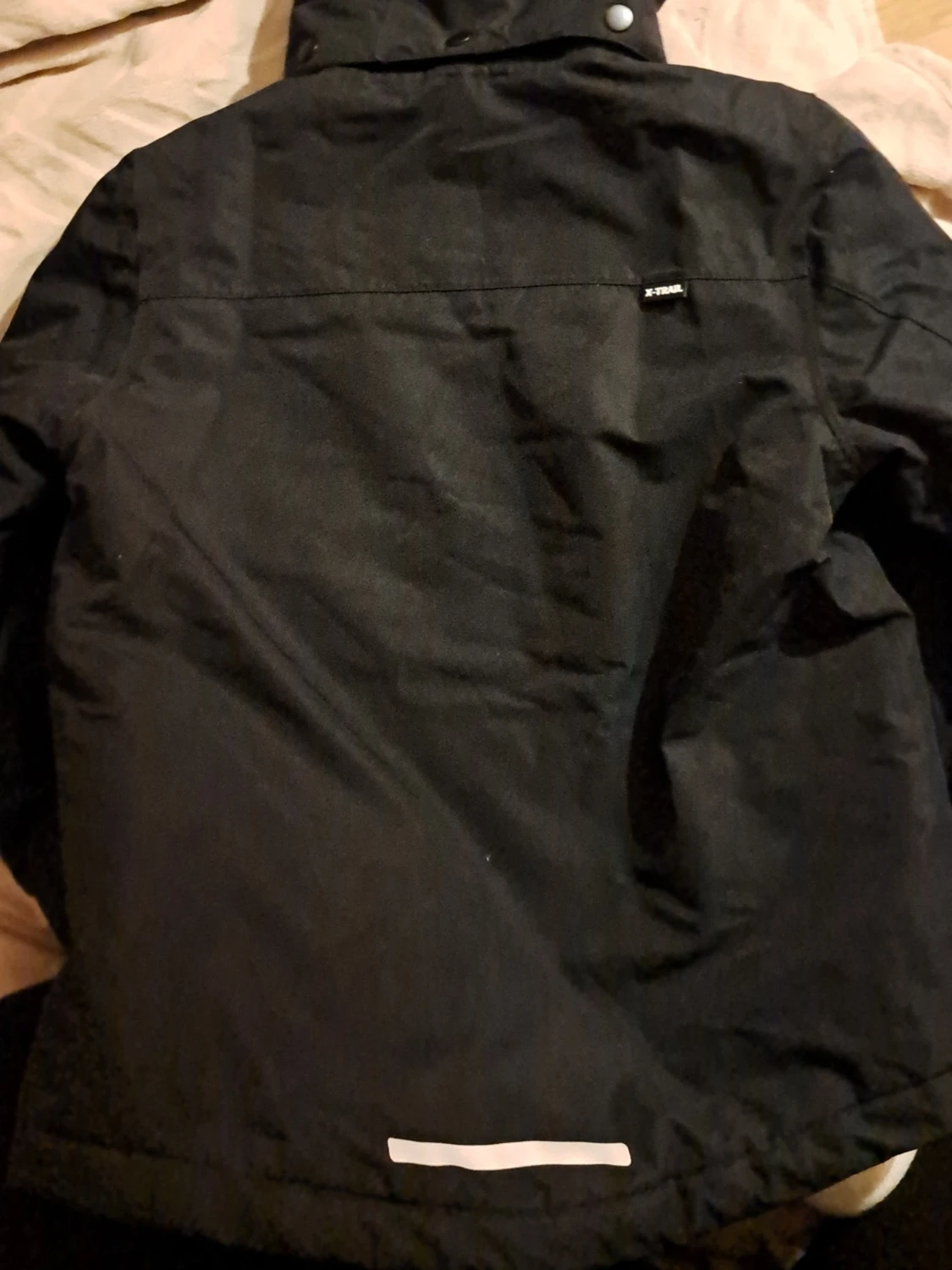 Svart vinterjacka från X-Trail med huva