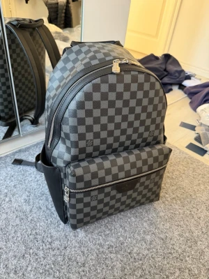 LV Black backbag - Its brand new has no stains or holes