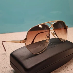 Yves saint Laurent sunglasses  - Yves Saint Laurent 8806 80's YSL luxury shades elegant 1980s sunglasses by Yves Saint Laurent LUXURY: gold-plated frame with titanium parts a true alternative to the ordinary 'Aviator-style NO RETRO shades, but a rare old 80's ORIGINAL Made for both 