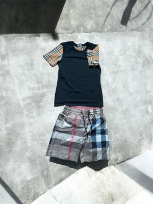 Burberry Tracksuit - Selling this summer BB tracksuit because of Ive grown taller and it doesn’t fit me anymore.  The tracksuit is in mint condition, have worn it only for events like twice  The t shirt says M but is S sized. The shorts says L but is S sized too.