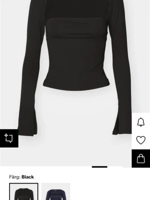 Svart långärmad topp från Gina  - Trendig svart långärmad topp från gina med figurnära passform. Toppen är stretchig och använt ett fåtal gånger men passar till allt.