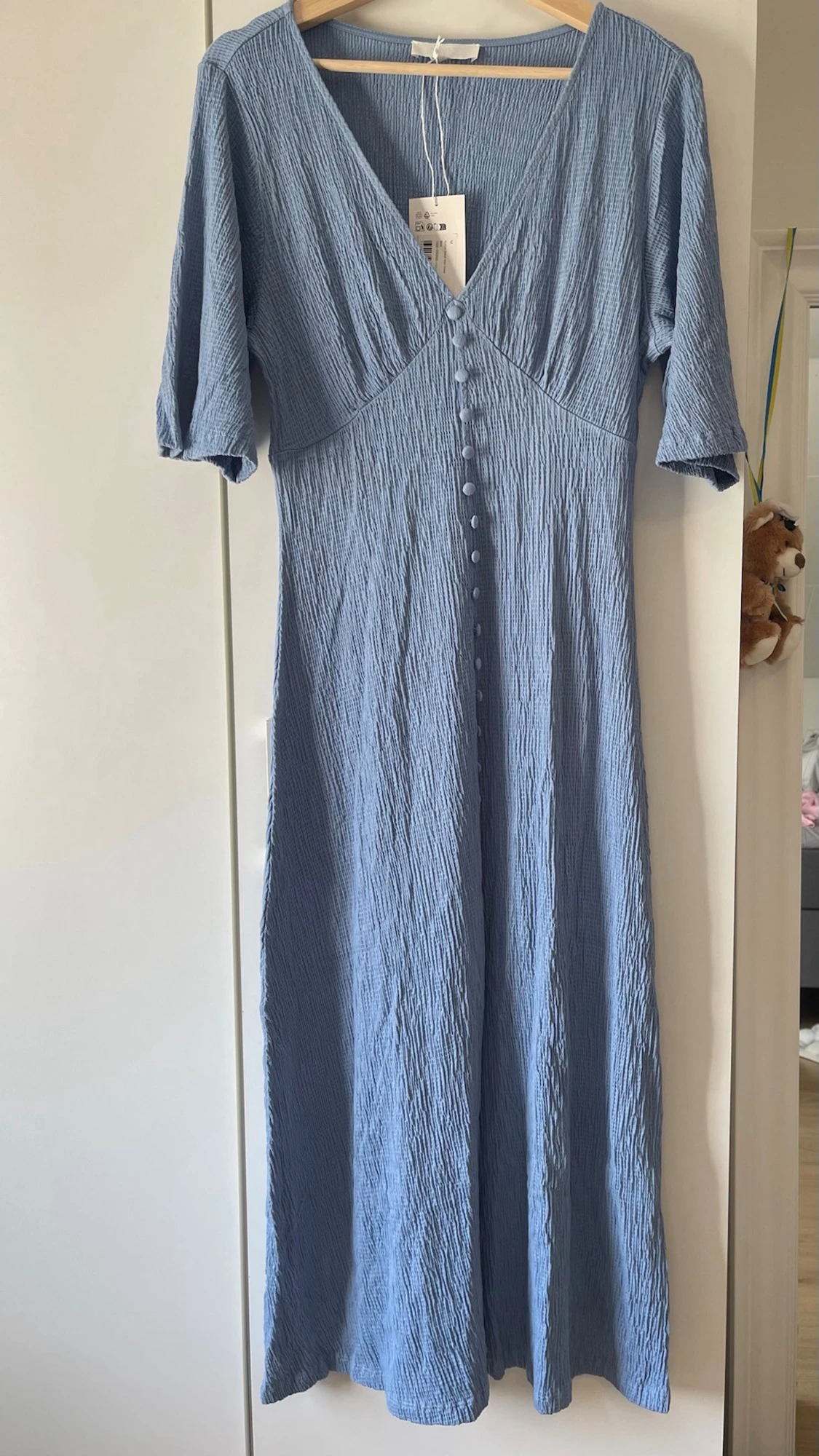 Ljusblå klänning med knappar - 1