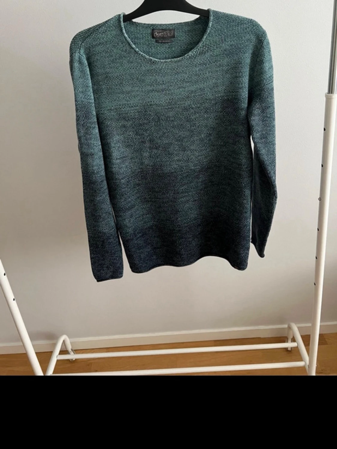 Grönmelerad stickad tröja