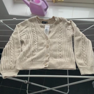 Kofta  - Het ny kofta i beige.