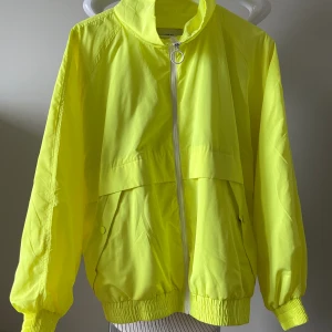 Neon yellow jacker with raglan sleeves  - Uesd but looks like new Brand pullandbear Color neon yellow  Size small/36