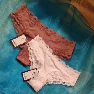 2pairs of lingerie/lace panty. Size: xsmall and small. Colors:white/brown Brandnew with tags.