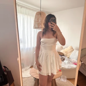 Backless spaghetti strap dress - This is a beautiful spaghetti strap dress in white colour, it’s unworn and new, I ordered it online and it’s not my size. It is stated that it’s medium but I think it would look better on small. Material is silky satin 