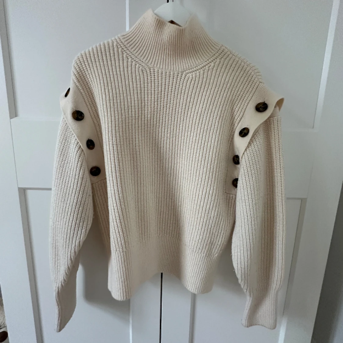 Tröja med avtagbara armar