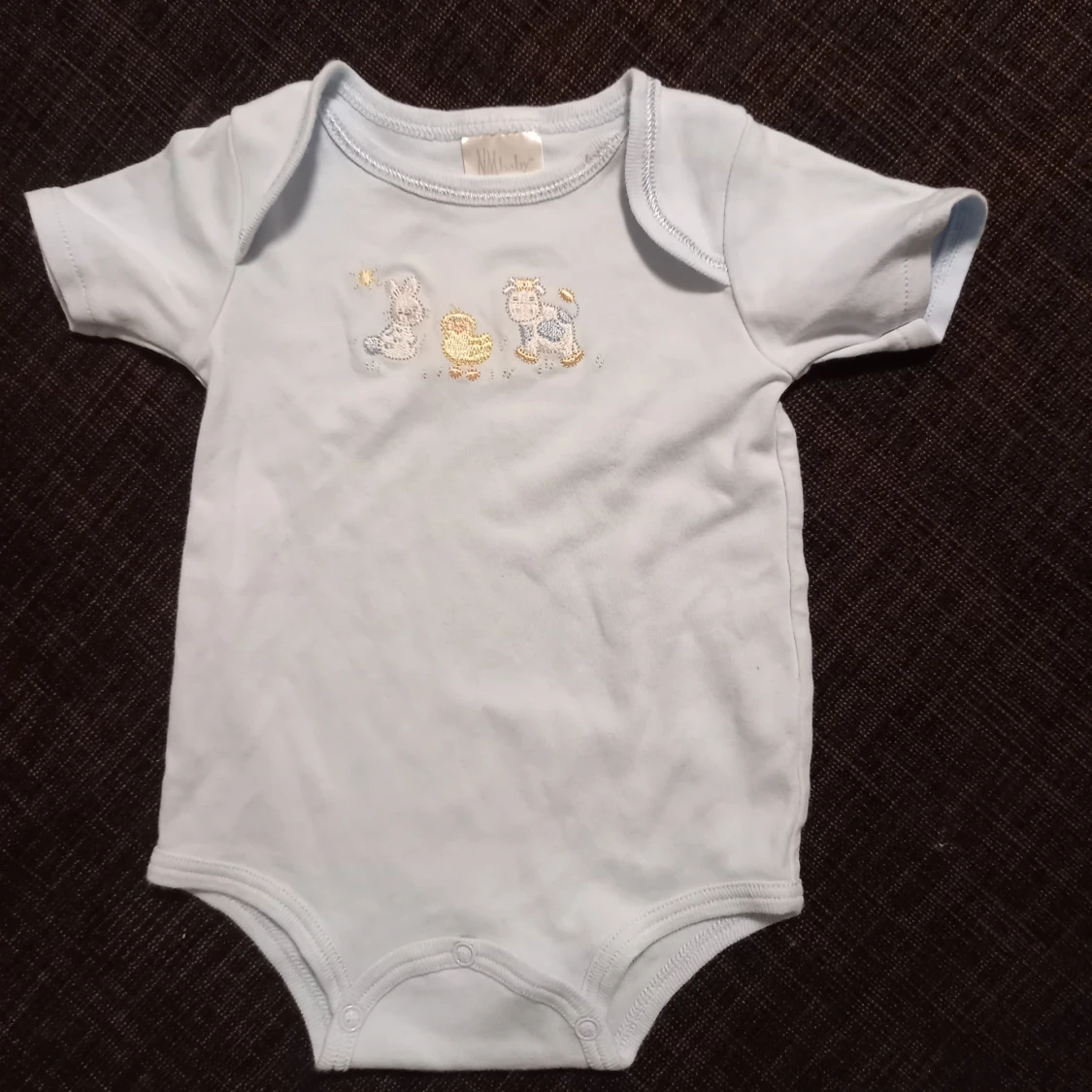 Ljusblå kortärmad body strl. 3 mån