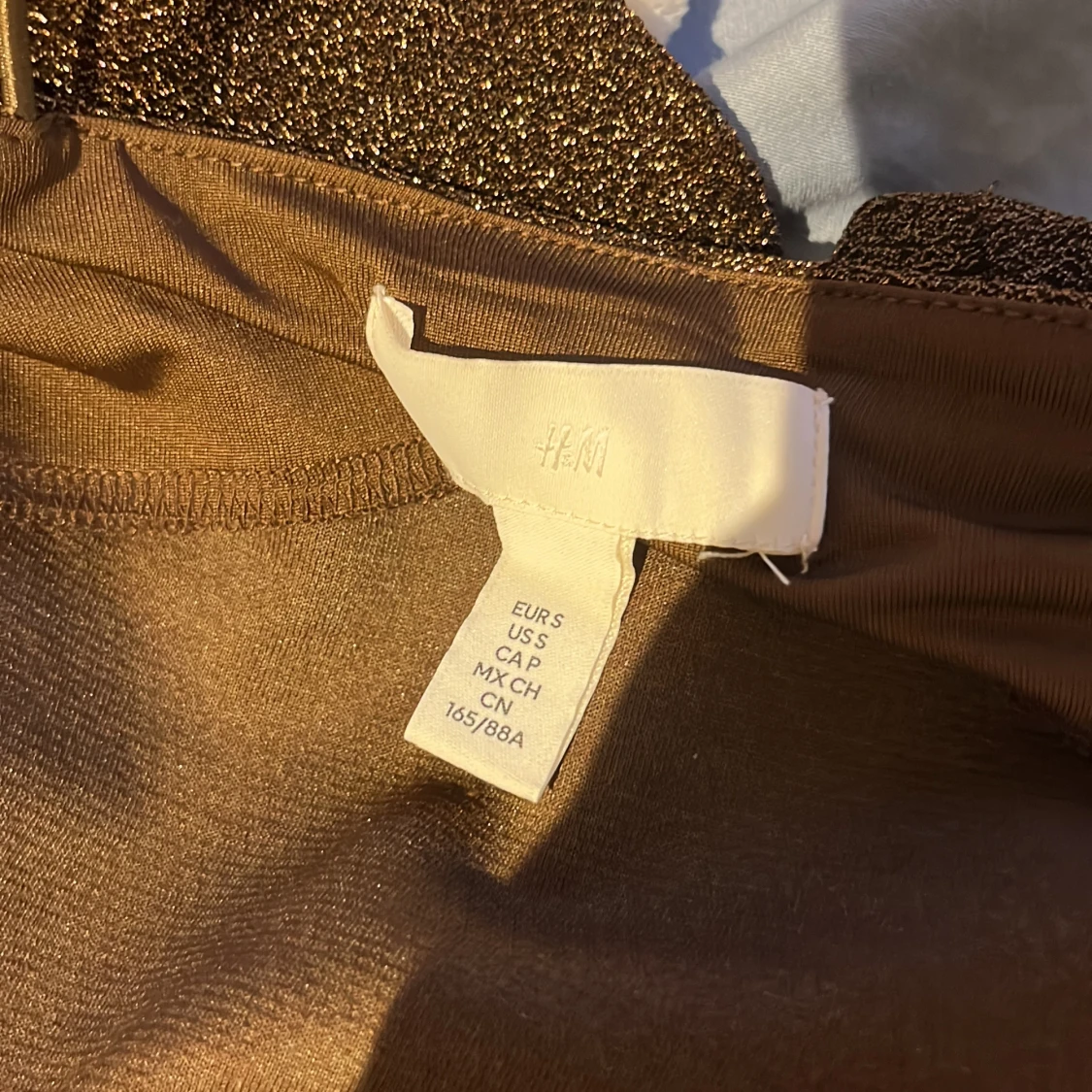 Glittrig brun body H&M - 3