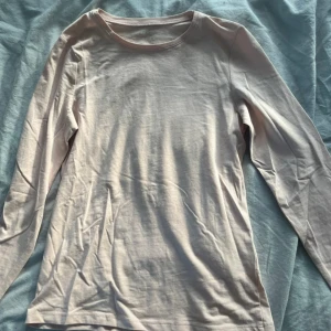 Ljusrosa långärmad T-shirt  - Ljusrosa långärmad T-shirt, storlek 164, passar XS