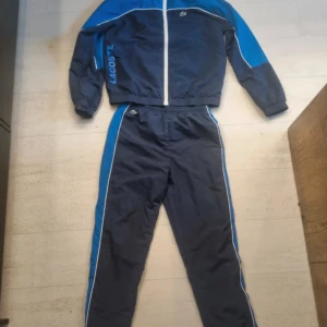 Lacoste Tracksuit - Bought from Zalando about 1.5 years ago for 150 euros, size 164. It was too small right away, so it's been used very little and is like new.