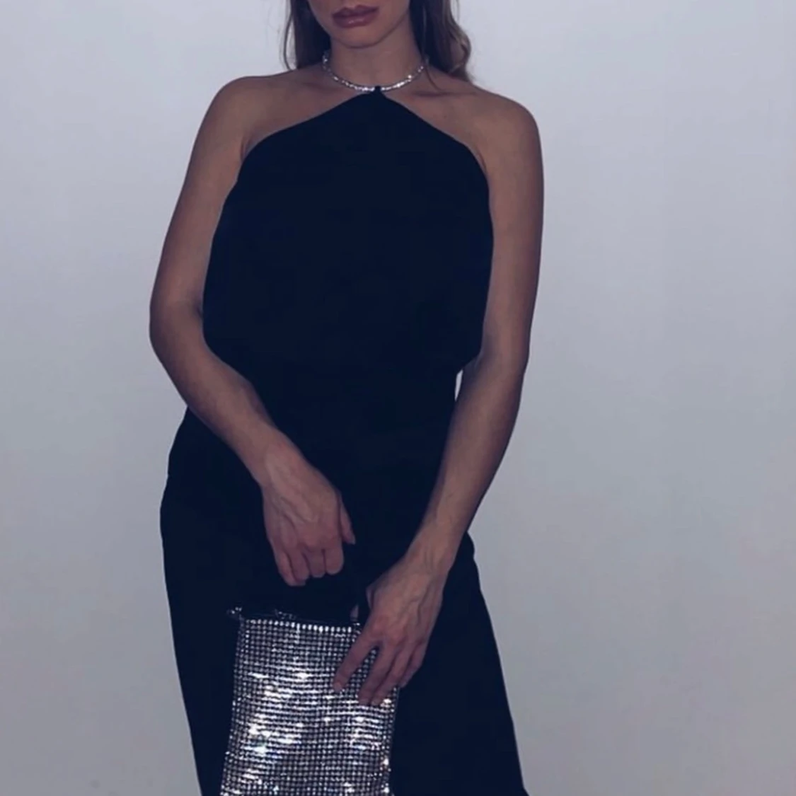 Svart linnetopp med glittrigt band