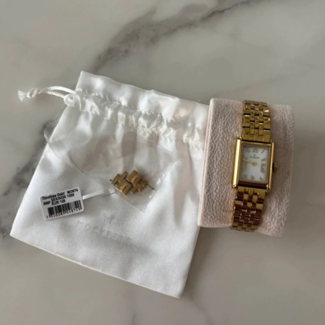 Guldfärgad klocka från Mockberg - 92