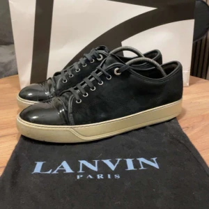 Lanvin skor - Snygga svarta Lanvin sneakers. Skick 7/10 dustbag ingår.