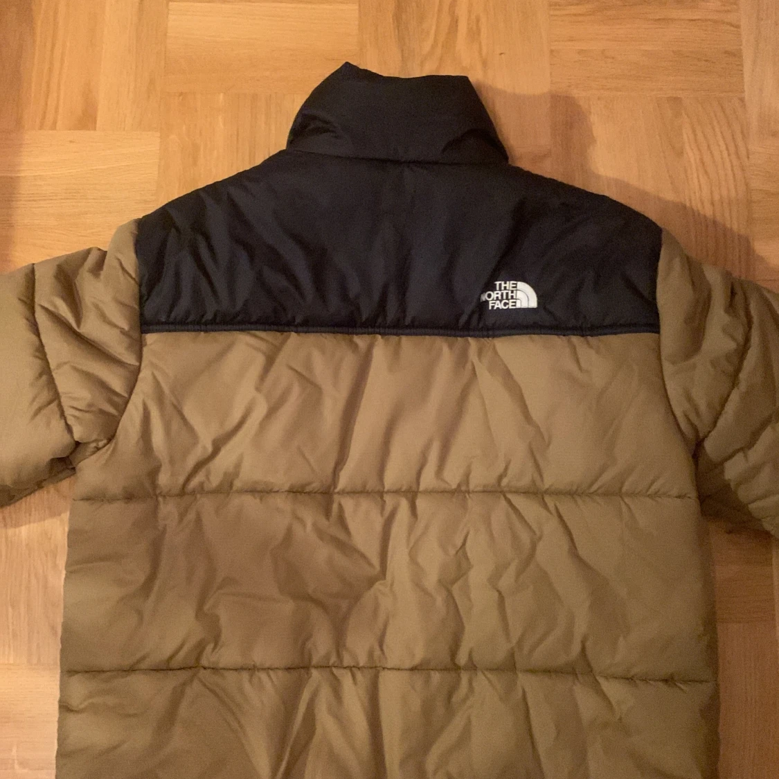 Brun och svart pufferjacka från The North Face - 91