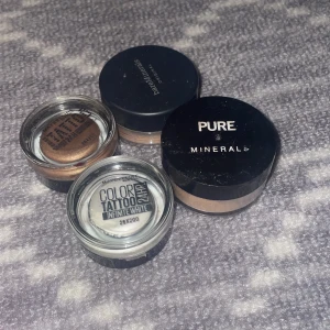 Ögonskuggor och mineralpuder - Säljer två krämögonskuggor från Maybelline Color Tattoo i nyanserna brons och vit, samt ett mineralpuder från Pure Minerals. Perfekt för att skapa både naturliga och dramatiska looker.