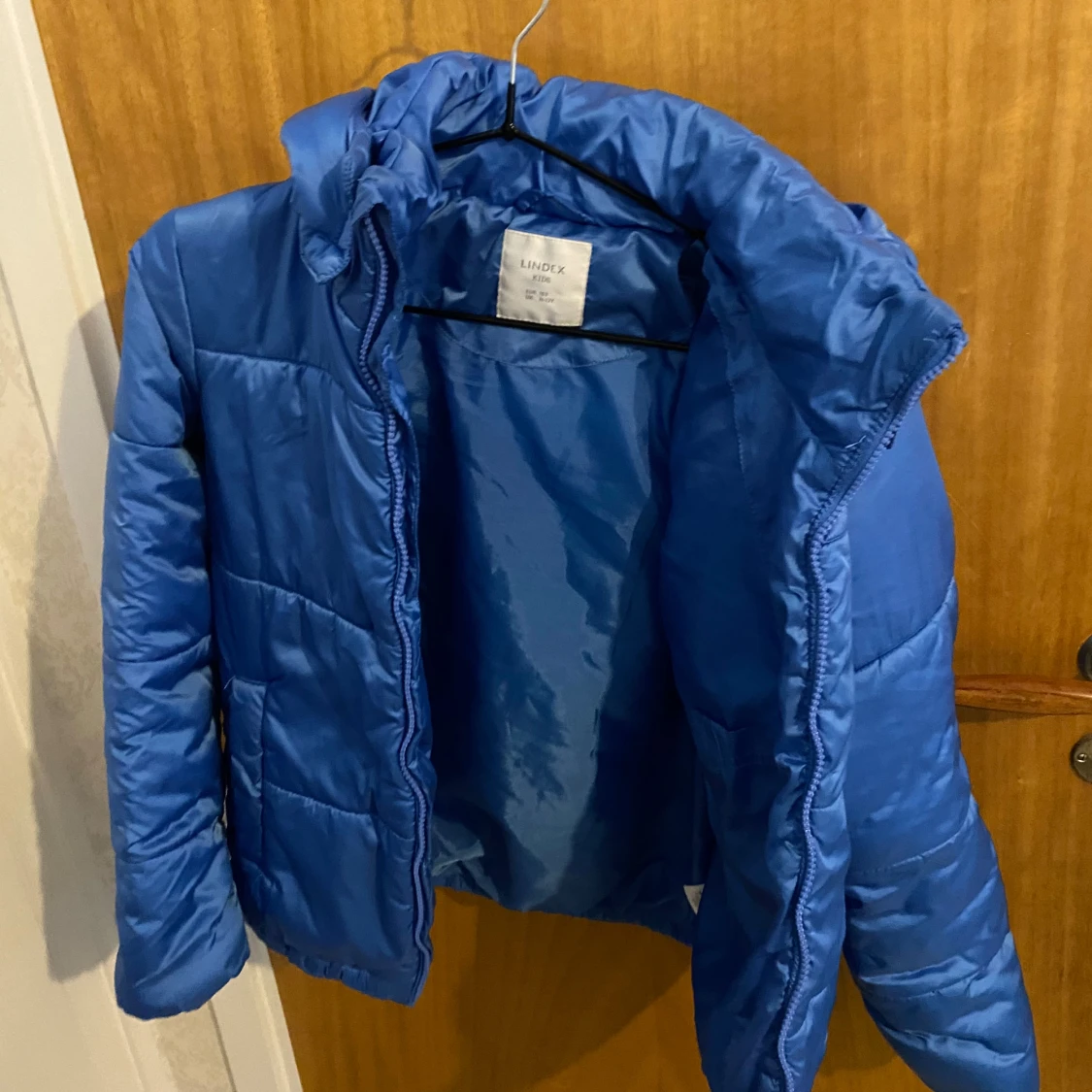 Blå pufferjacka från Lindex Kids - 91